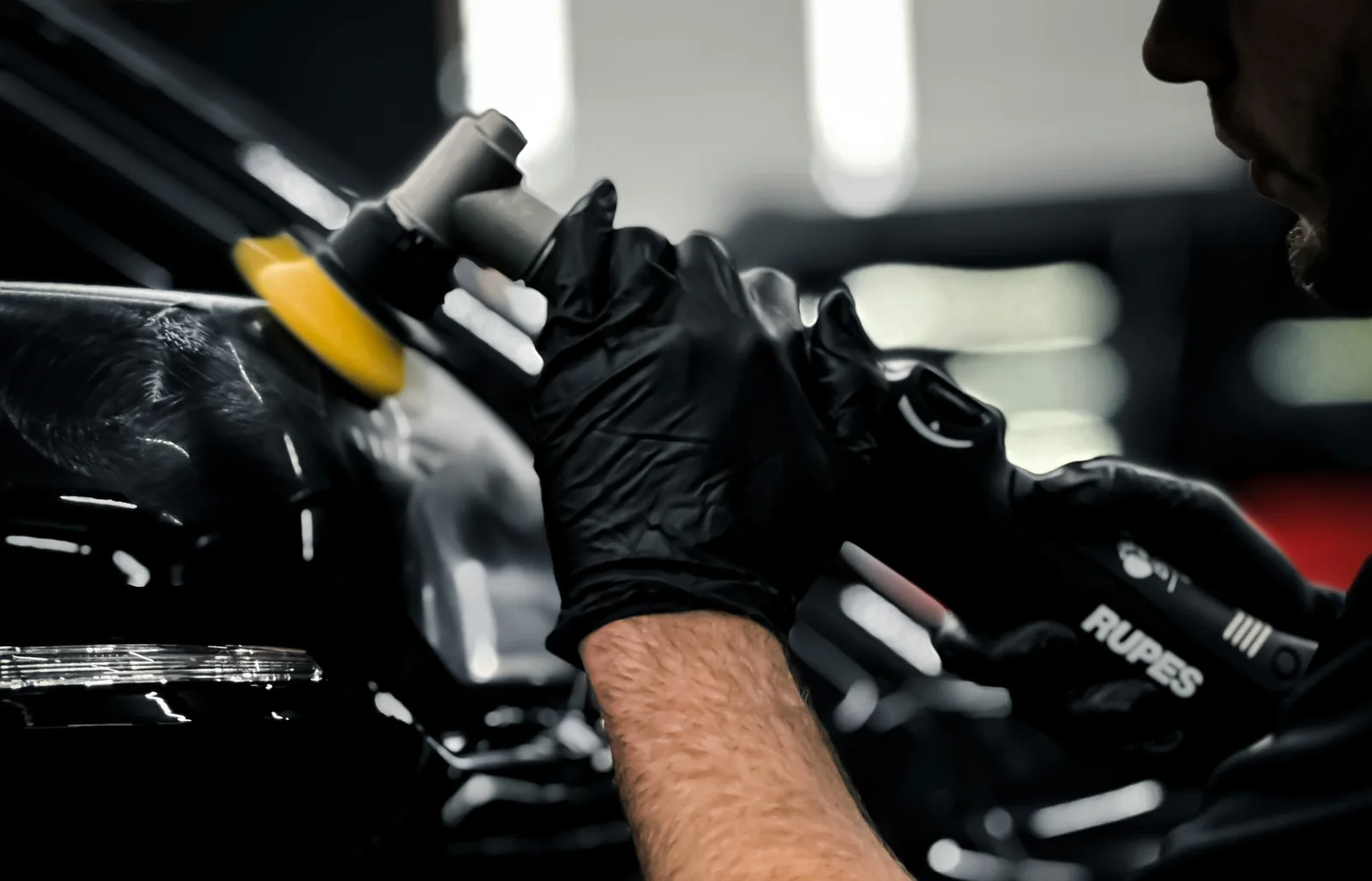 Specialist machine polishing on dark paintwork