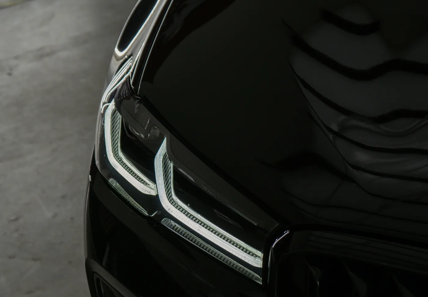A carefully polished vehicle headlight and bonnet